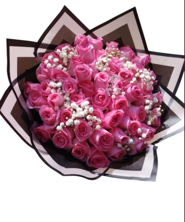 Luxurious bouquet of pink roses with delicate baby's breath, elegantly wrapped in black and white paper, perfect for romantic gestures and special celebrations.