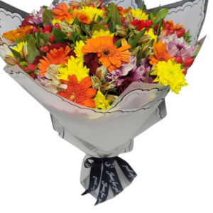 Bright and cheerful bouquet of orange gerberas, yellow chrysanthemums, and mixed flowers wrapped in elegant paper, perfect for celebrations and joyful moments.