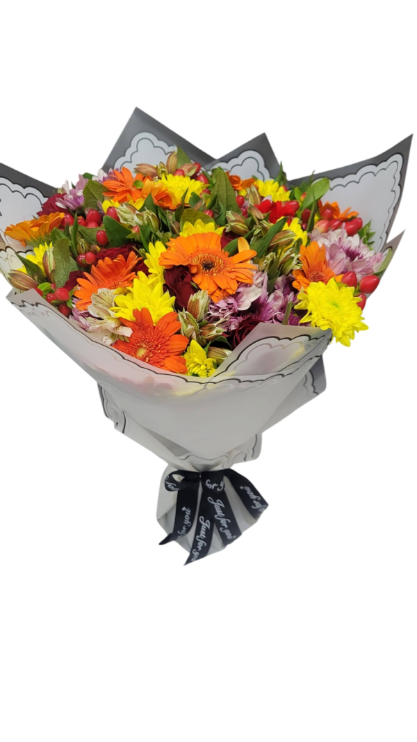 Bright and cheerful bouquet of orange gerberas, yellow chrysanthemums, and mixed flowers wrapped in elegant paper, perfect for celebrations and joyful moments.