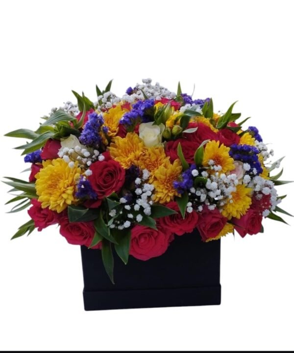 A striking floral arrangement featuring red roses, bright yellow chrysanthemums, delicate white baby’s breath, and pops of purple flowers, beautifully arranged in a sleek black box. The vibrant color combination adds a touch of elegance and joy, making it an ideal gift for any special occasion.