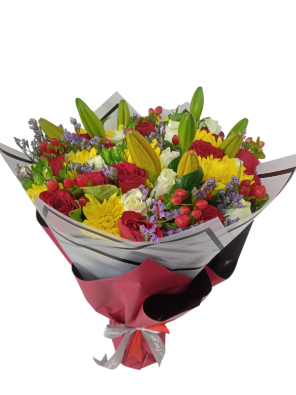 A vibrant bouquet featuring red roses, yellow chrysanthemums, white flowers, unopened lily buds, and small purple blossoms, wrapped in elegant black and red paper with a white ribbon.