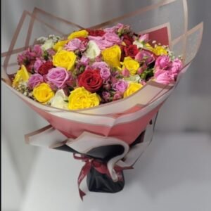 A beautifully arranged bouquet featuring a mix of red, yellow, pink, and lavender roses, wrapped elegantly in layered paper with a stylish ribbon. This vibrant and romantic floral arrangement makes for a perfect gift for special occasions, expressing love, joy, and appreciation.