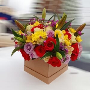 Gorgeous mixed flower arrangement with red roses, yellow chrysanthemums, purple lisianthus, and lilies in a stylish gift box, perfect for any special occasion.