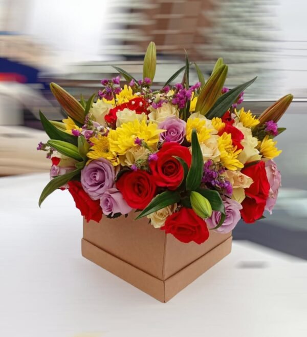 Gorgeous mixed flower arrangement with red roses, yellow chrysanthemums, purple lisianthus, and lilies in a stylish gift box, perfect for any special occasion.