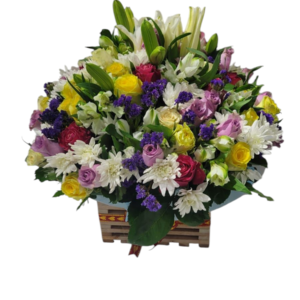 Stunning mixed flower arrangement with roses, lilies, daisies, and purple blooms in a decorative wooden basket, perfect for gifting and special occasions.