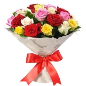 Stunning bouquet of mixed roses in red, pink, yellow, and white, elegantly wrapped in white paper with a red ribbon.