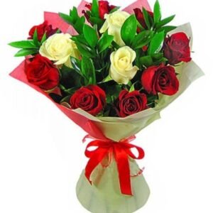 Beautiful bouquet of red and white roses with lush greenery, wrapped in red and white paper with a decorative ribbon